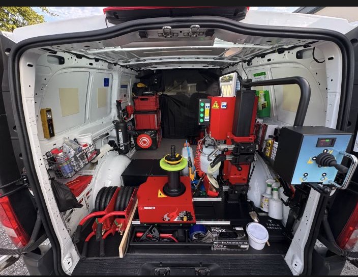 Complete tire mounting and balancing setup inside the Better Tire service van